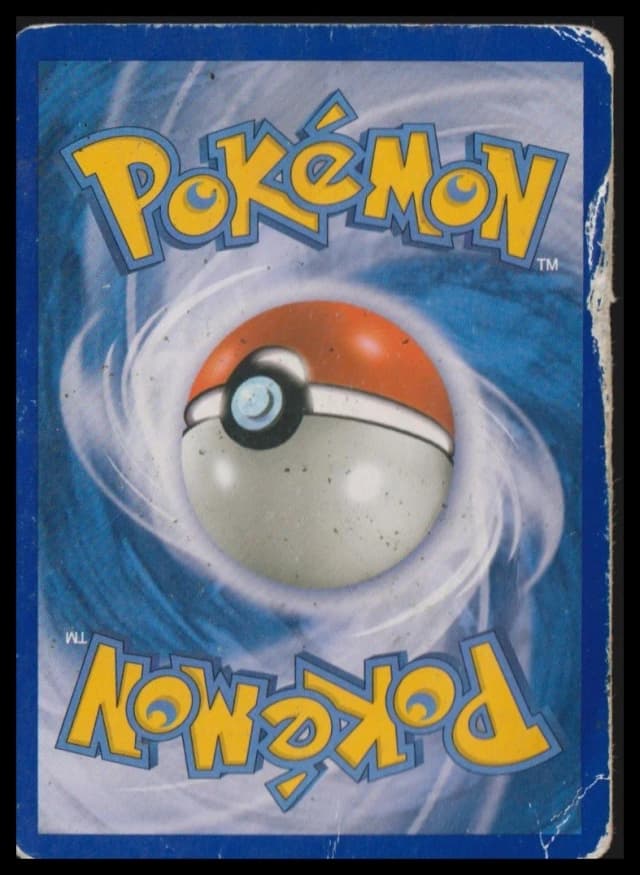 Damaged condition Pokemon card example showing a torn edge and creased surface
